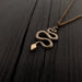 Gold chain necklace with detailed snake pendant | Moon Raven
