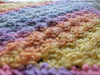 Close-up photograph of the altar cloth to show the texture of the stitches.