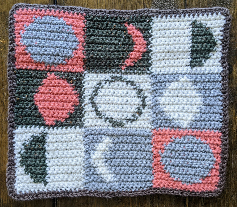 Photograph of the green, pink, and grey tarot cloth without anything on it.