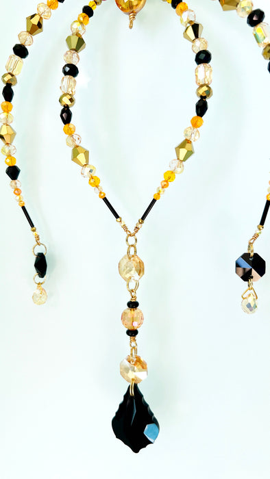 Gilded Shadow – Black & Gold Beaded Spider Suncatcher