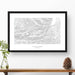 Map wall decor in a black frame. Contour lines of Enchantments, Washington are drawn on a white background. Text  below the map can be customized to create custom adventure art.