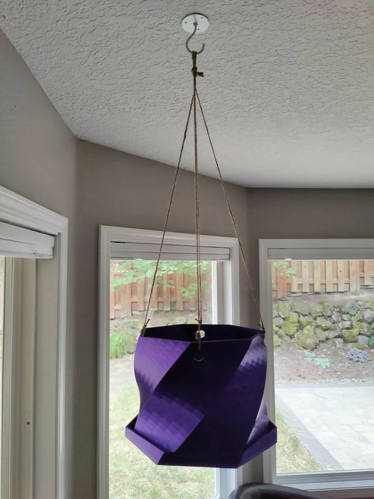 Twisted Elegance: The Hanging Planter with integrated drainage