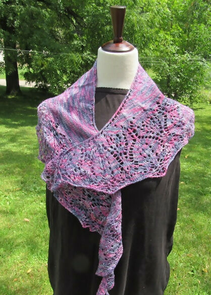purple variegated variant of the tulip shawl on a black dress form