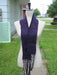 dark purple scarf with a narrow cable motif and fringe