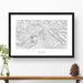 Map wall decor in a black frame. Contour lines of Mount Baker, Washington are drawn on a white background. Text  below the map can be customized to create custom adventure art.