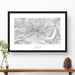Map wall decor in a black frame. Contour lines of Mount Hood, Oregon are drawn on a white background. Text  below the map can be customized to create custom adventure art.