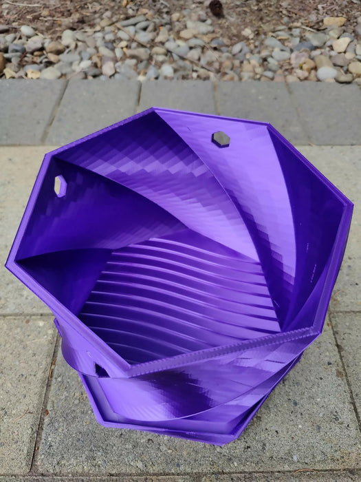 Twisted Elegance: The Hanging Planter with integrated drainage