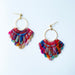 A pair of handmade fan-shaped polymer clay earrings displayed on a white background. The earrings feature gold-plated ball posts and hoops, with semi-transparent rainbow-colored clay and red etched fan-like lines. The marbling effect shows swirls of pink, blue, green, orange, and white.