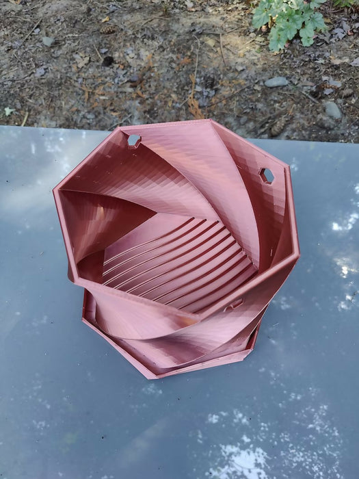 Twisted Elegance: The Hanging Planter with integrated drainage