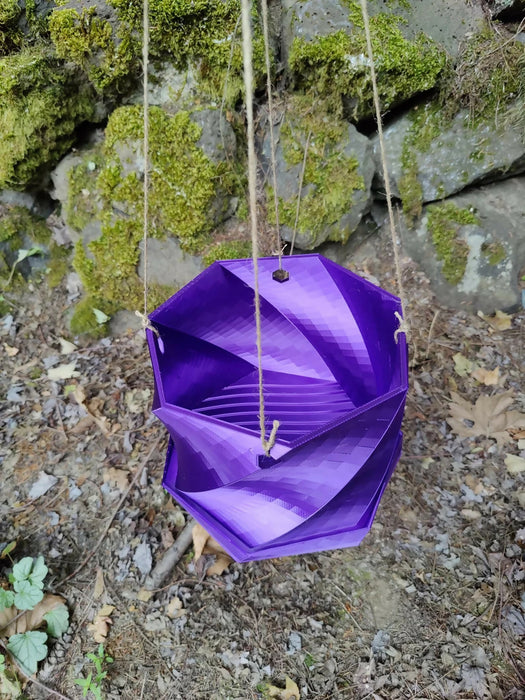 Twisted Elegance: The Hanging Planter with integrated drainage