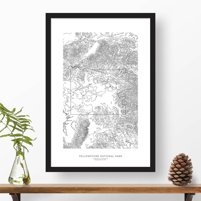 National park print of Yellowstone National Park with black and white topography in a black 24x36 vertical frame.
