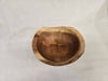 A distant picture of a natural edge wooden cherry bowl
