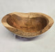 A close picture of a natural edge wooden cherry bowl