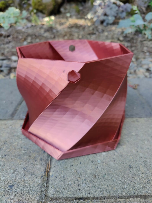 Twisted Elegance: The Hanging Planter with integrated drainage
