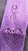 closeup of the heart motif on a purple scarf