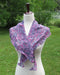 purple variegated variant of the tulip shawl on a white dress form