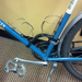 Black leather "little lifter" bike handle shown on blue bike frame