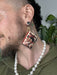 Beautifully handmade and hand sewn sustainable cork earrings featuring queer love stories of 50's inspired queer women.