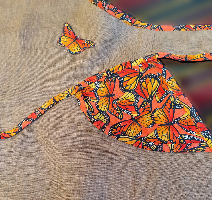 Side accent pockets with applique and edge binding